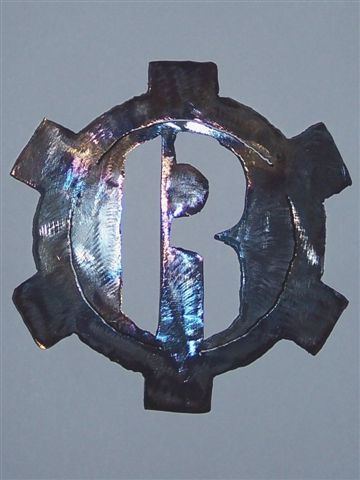 'Reclamation Logo.' by Dragonforge Ironworks
